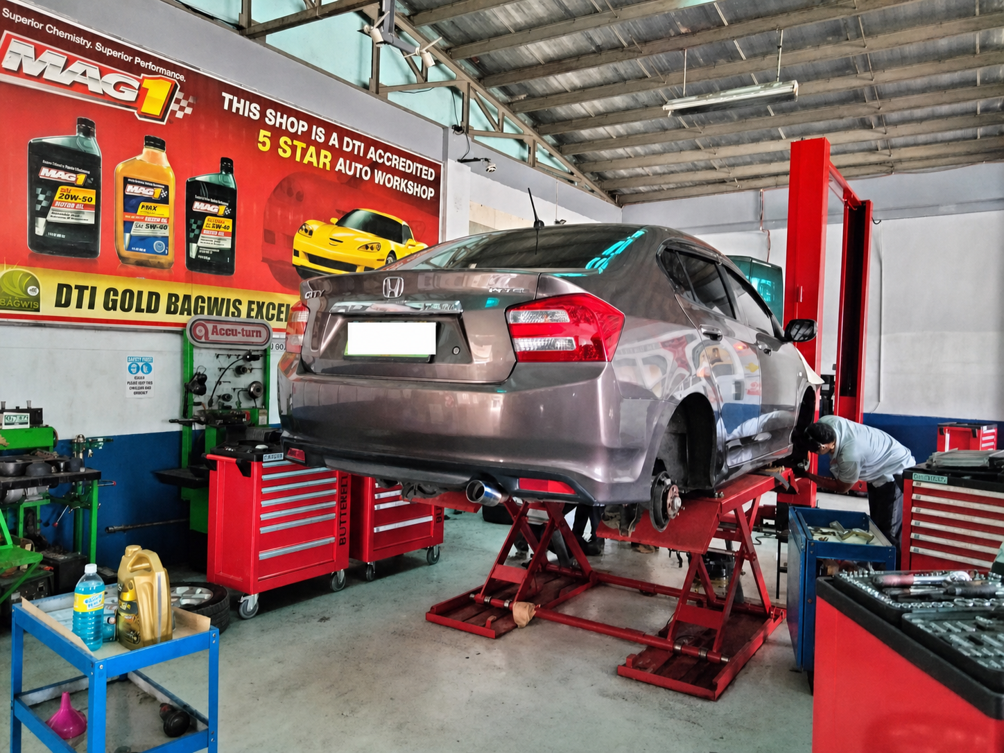 Vehicle being serviced on a workshop lift