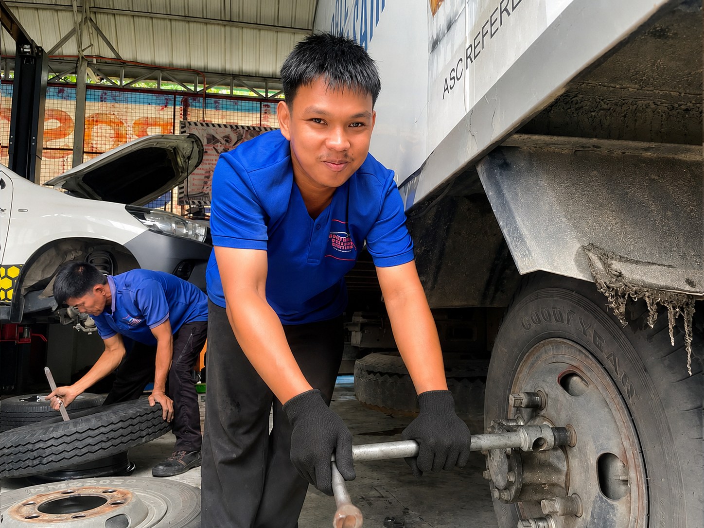 Northeast Car Care Centre mechanics servicing truck tires
